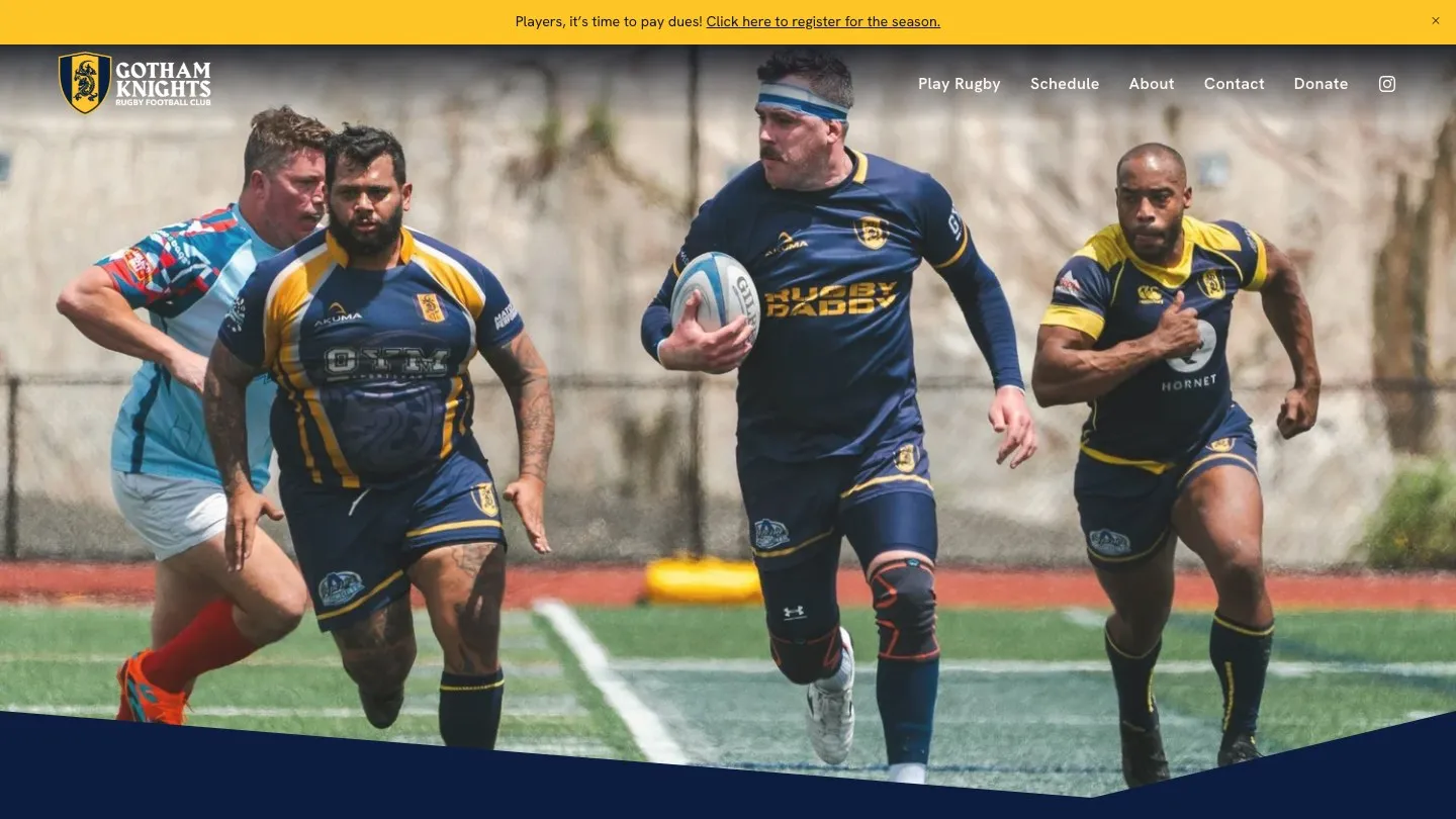 The club website: a full-bleed matchday photo with a navy band and gold accents